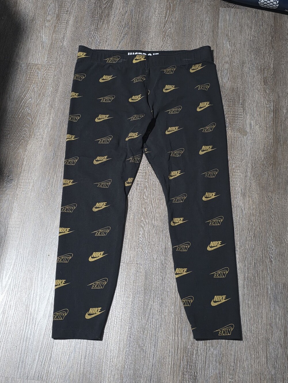 Womens Nike Black Leggings with Gold Logo Print